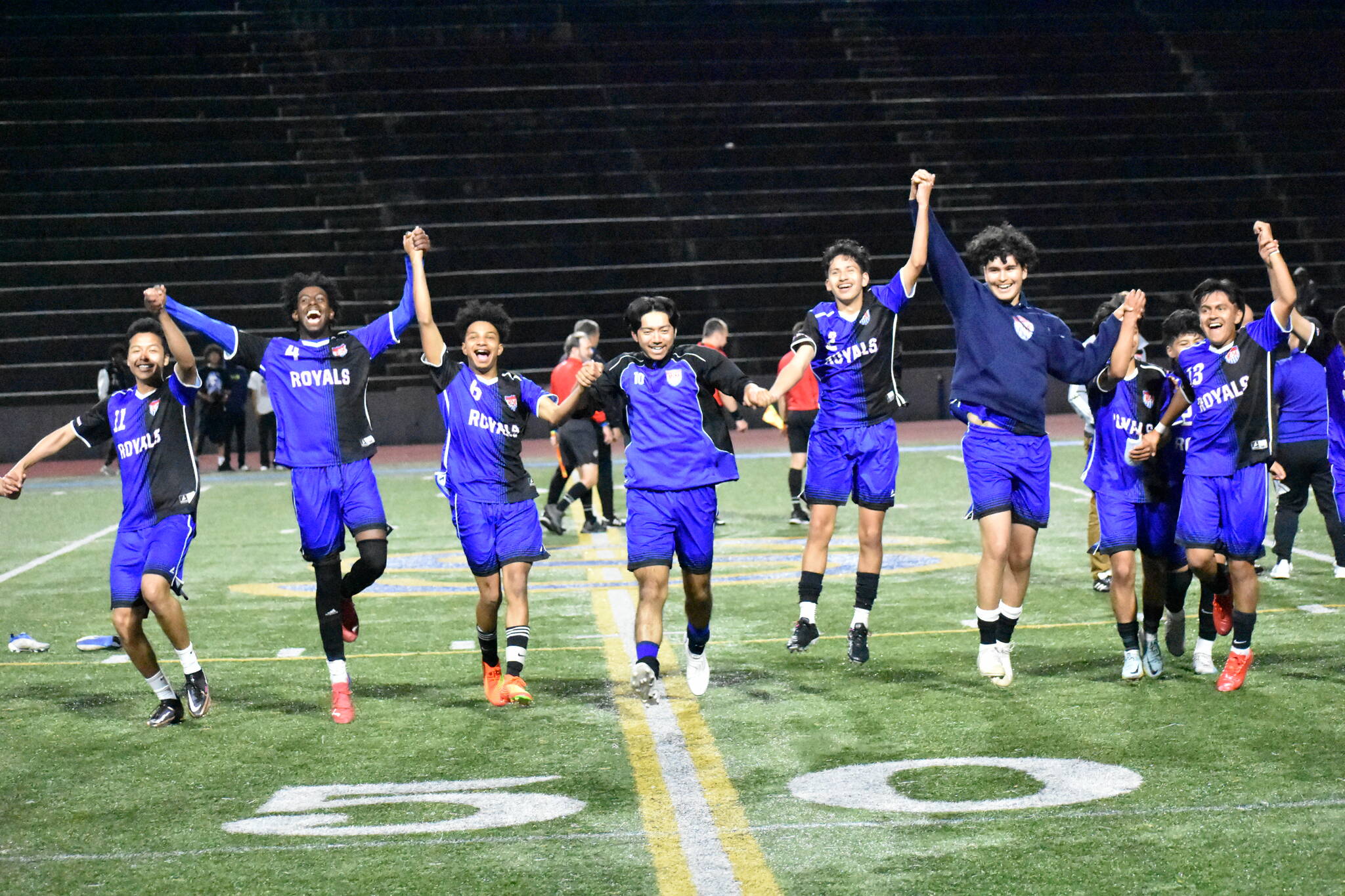 Kent-Meridian celebrating the win after the game, but giving respect to the crowd. Ben Ray / The Reporter