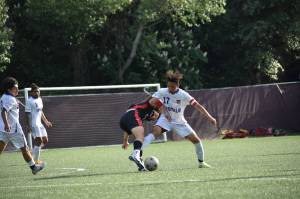 Royals junior Andres Zuluaga takes on a Ballard defender. Ben Ray / The Reporter