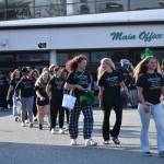 Kentwood High softball heads out from the Covington school to the state tournament sandwiched between the students and the pep band. Ben Ray / The Reporter