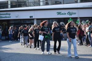 Kentwood High softball heads out from the Covington school to the state tournament sandwiched between the students and the pep band. Ben Ray / The Reporter