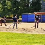 Volunteers work May 26 on Kent Little League fields, part of a Mariners Communities All-Star program to clean up the park. COURTESY PHOTO, Kent Little League