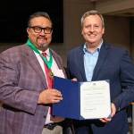 Mauricio Ayon Rodriguez, left, receives a MLK Distinguished Service honor from King County Councilmember Dave Upthegrove. COURTESY PHOTO, King County