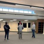 Kent School Board President Joe Bento, left, board member Tim Clark and district administrator Wade Barringer tour the new library at Canyon Ridge Middle School. COURTESY PHOTO, Leslie Hamada