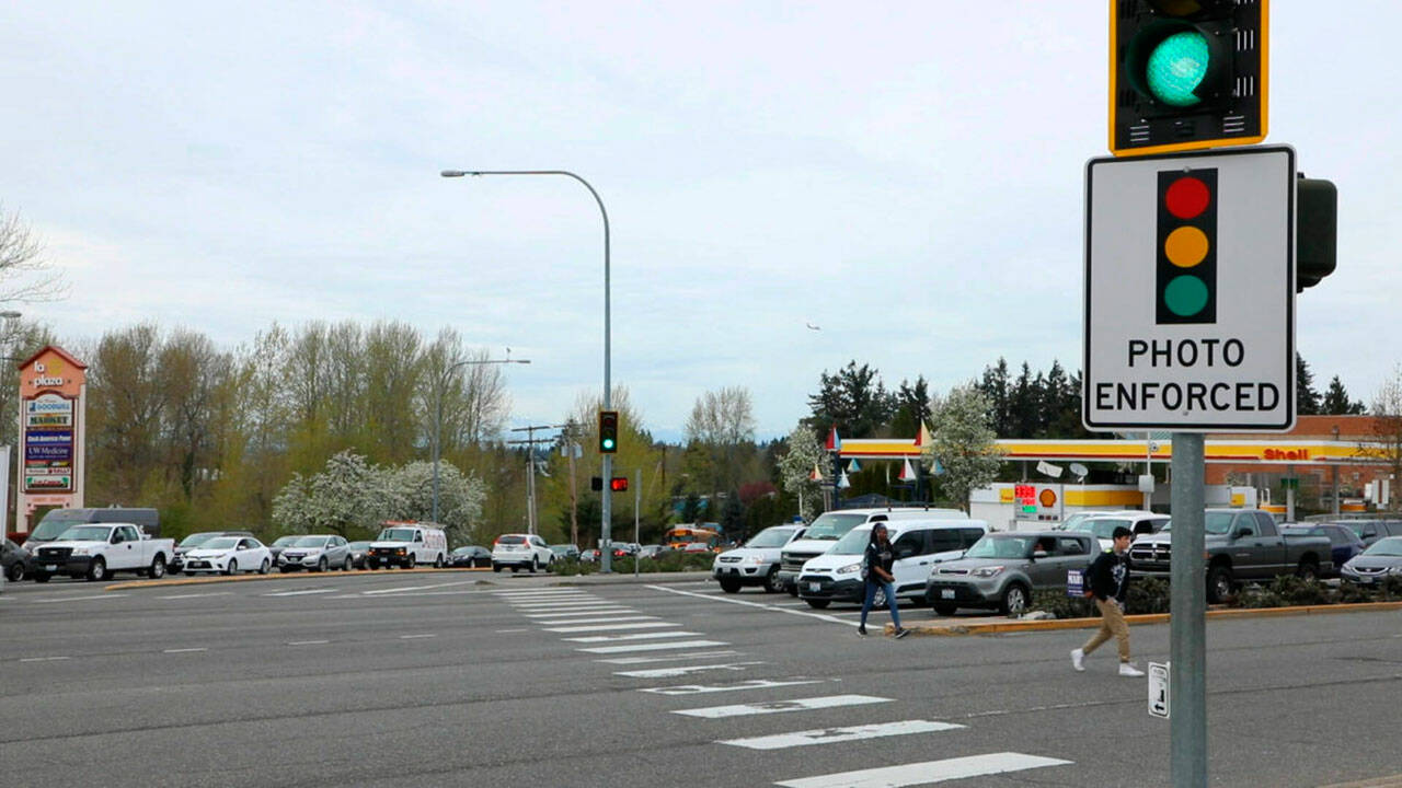 A red-light camera sign at Pacific Highway South and Kent Des Moines Road, one of six intersections where the city of Kent has had cameras since 2019. COURTESY FILE PHOTO, Kent Police