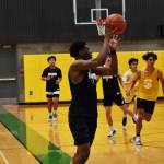 Kentwoods Corey Tita catches a pass from Brandon Tagle against Stadium in a summer league game. BEN RAY, The Reporter