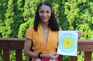 Ivone Langford, a Federal Way resident, holds her design that will be used at the upcoming Sound Transit link right rail Kent/Des Moines station. Alex Bruell/Sound Publishing