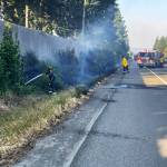 Puget Sound Fire battles a brush fire July 4 along westbound Highway 18, just west of the SE 256th Street exit. COURTESY PHOTO, Puget Sound Fire