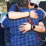 Michael Coury, the father of Gabriel, receives a hug. STEVE HUNTER, Kent Reporter