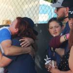 Shellie Coury, the mother of Gabriel, receives a hug as family members stand nearby. STEVE HUNTER, Kent Reporter