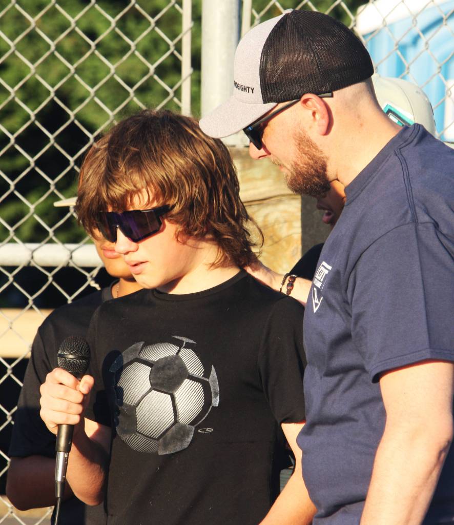 A friend talks about Gabriel Coury as Michael Coury looks on. STEVE HUNTER, Kent Reporter