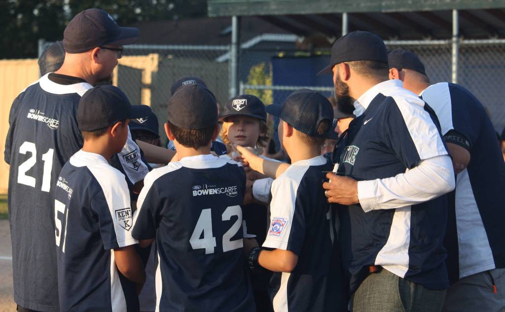 Gabriel Courys Kent Little League teammates gather at the pitchers mound. STEVE HUNTER, Kent Reporter