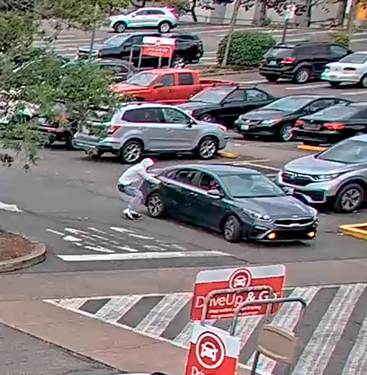Des Moines Police released this photo of a suspect and suspect vehicle in a July 24 shooting at a Des Moines Safeway at South 214th Street and Pacific Highway South. COURTESY PHOTO, Des Moines Police