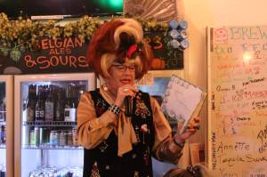 Photo by Bailey Jo Josie/Sound Publishing.
Sylvia OStayformore reads a Christmas-themed childrens book to the crowd. For Sylvia, it was no question that Story Time would continue, even if protesters had shown up on Saturday.