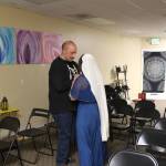 Noah Tassie and Julia Sayn rehearse their dance for the Yule skit they will perform during the ritual. "It's very spiritually welcoming," Tassie said of Triple Goddess Coven. Photo by Bailey Jo Josie/Sound Publishing.