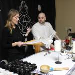 High Priestess Syleena and High Priest Kalu go through the ritual to make sure everything flows well together. This is the second sabbat their coven has utilized the space at 4 Sisters in Renton though they hope to have their own space in the future. "It's not much fun packing and unpacking everything," Syleena said with a laugh. Photo by Bailey Jo Josie/Sound Publishing.