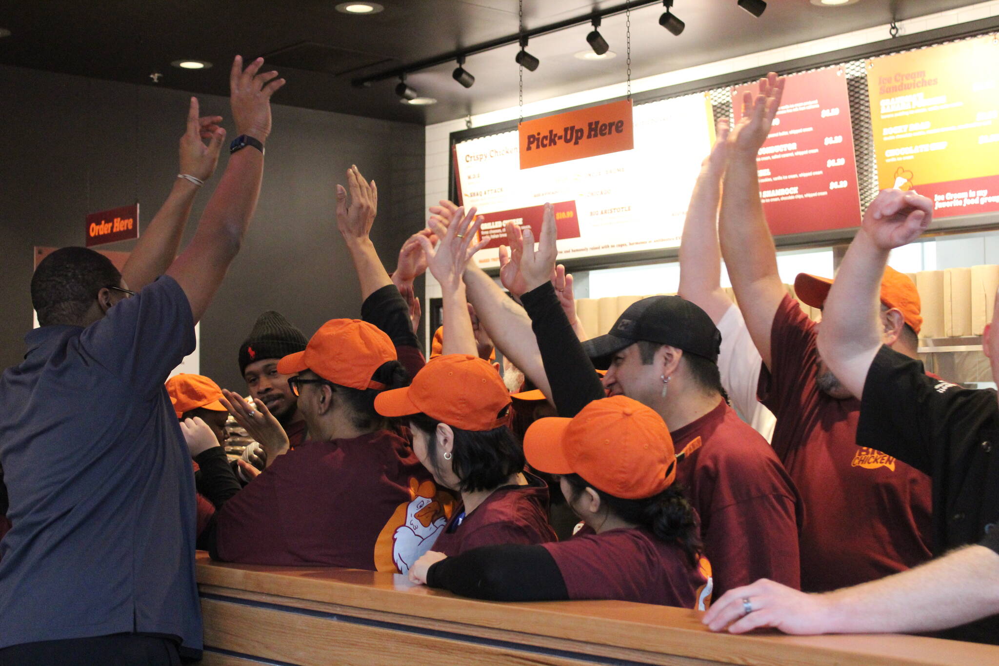 Photo by Bailey Jo Josie/Sound Publishing.
Minutes before Big Chickens grand opening, the crew brought all hands in.