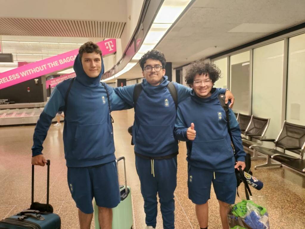Head Coach Alex Ruiz (middle), Owen Ortega-Phillips (right) and George Lewis (left) at the SeaTac Airport. (Photo provided by Alex Ruiz)