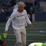 Seahawks Coach Pete Carroll going for a high-five with the defense. (Photos by Ben Ray / Sound Publishing)