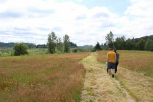 Residents walk the grounds of the future East Hill Community North Park in Kent. FILE PHOTO, Kent Reporter