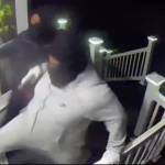 Screenshot of surveillance video that shows intruders trying to break into an Auburn residence.