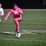 Leila Ramirez-Noon runs past a Kennedy Catholic player. Ben Ray / The Reporter