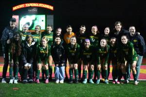 Team photo after the win against Rogers. Ben Ray / The Reporter