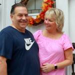 Photo by Keelin Everly-Lang / The Mirror
Dale and Denise Pac in front of their family home.