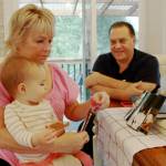Photo by Keelin Everly-Lang / The Mirror
Denise and Dale Pac looking at photos and yearbooks from their high school days with their first grandchild.