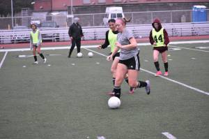 Hayden Rallo controls the ball at Kentlake practice. Ben Ray / The Reporter