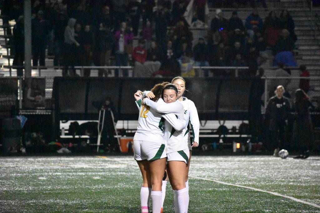 Two Chargers hug after the final whistle. Ben Ray / The Reporter