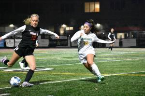 Lauren Covello gets ready to lunge for a challenge. Ben Ray / The Reporter