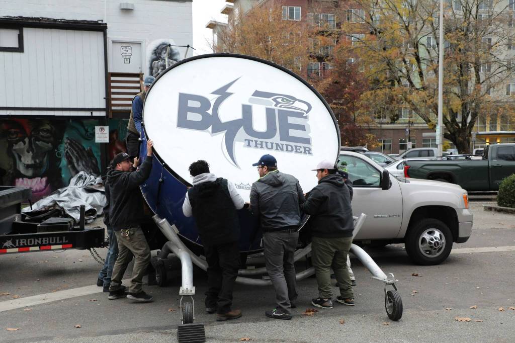 A whole crew of Seattle Seahawks staff were needed to lift the drum. (Cameron Sheppard/Sound Publishing)