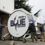 The bass drum is wheeled into the Renton History Museum. (Cameron Sheppard/Sound Publishing)
