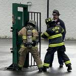 Recruit firefighters are taught how to force entry through a door. COURTESY PHOTO, Puget Sound Fire