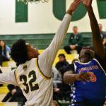 Amare Brown contests a shot from an Auburn Mountainview player. Ben Ray / The Reporter