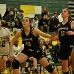 Hailey Anderson (Black) and Tia Schanbeck (White) try and snag a rebound. Ben Ray / The Reporter