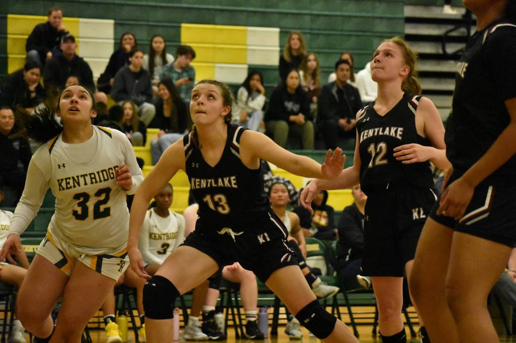 Hailey Anderson (Black) and Tia Schanbeck (White) try and snag a rebound. Ben Ray / The Reporter