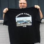 Monte Carlo Pub owner Jeff Kohler holds up a T-shirt honoring the 34 years the bars been in business in Kent along West Meeker Street. STEVE HUNTER, Kent Reporter