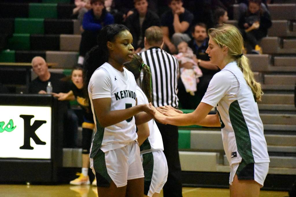 Ajayi and Boris high five after a foul by a Tahoma player. Ben Ray / The Reporter
