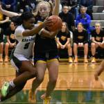 Kentwoods Jessica Ajayi battles through the contact. Ben Ray / The Reporter