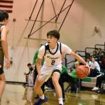 Kentwood sophomore Brandon Tagle engages a Tahoma defender. Ben Ray / The Reporter