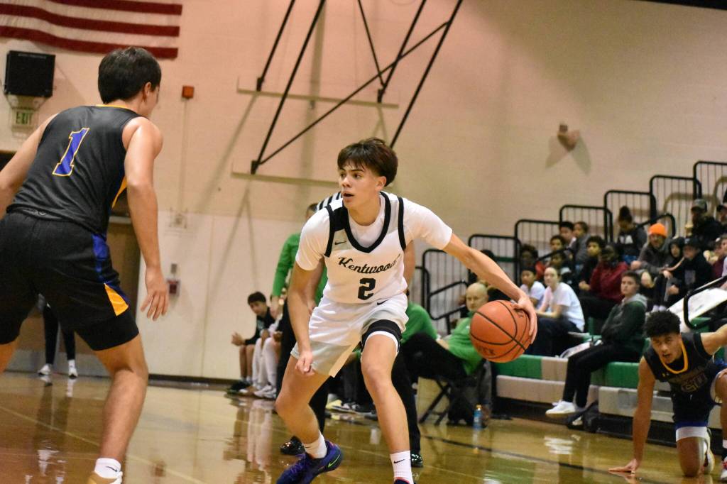 Kentwood sophomore Brandon Tagle engages a Tahoma defender. Ben Ray / The Reporter