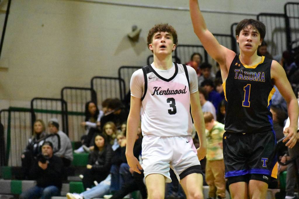 Blake Stempniak watches on as a Tahoa player calls for the ball. Ben Ray / The Reporter