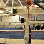 Royals Joel Remos with a finger-roll layup against Auburn Riverside. Ben Ray / The Reporter