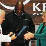 Les Thomas receives recognition for his 20 years on the council from Council President Bill Boyce, center, and Mayor Dana Ralph. STEVE HUNTER, Kent Reporter