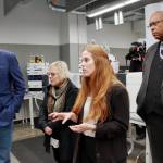 Technical lead Madison Fuller shows the toxicology labs new equipement to Gov. Jay Inslee, State Sen. Claire Wilson and John Batiste. Fuller will take on a new role as quality assurance manager in January. Photo by Keelin Everly-Lang / The Reporter