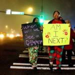 Students hold signs sharing their fear of being the next victim of a vehicle / pedestrian collision as they walk to school Dec. 18. (Photo by Keelin Everly-Lang / Sound Publishing)