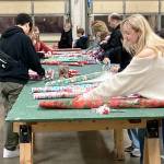 Volunteers wrap gifts for the annual Toys for Joy program. COURTESY PHOTO, Puget Sound Fire