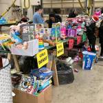 Volunteers sort toys donated for the Toys for Joy program. COURTESY PHOTO, Puget Sound Fire