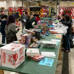 Volunteers sort items for the Toys for Joy program. COURTESY PHOTO, Puget Sound Fire